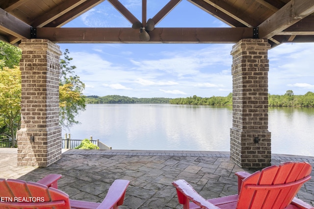 view of patio featuring a water view