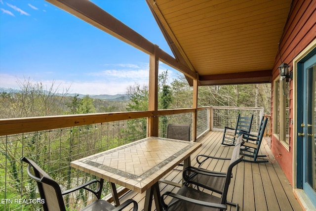 wooden terrace featuring a mountain view