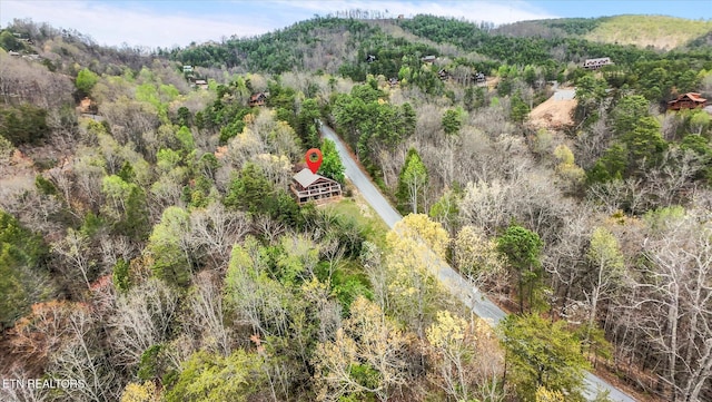 aerial view with a wooded view