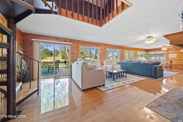 3576 E Atherton Ln, Baneberry, TN 37890 - living room featuring wood walls, ceiling fan, and wood finished floors
