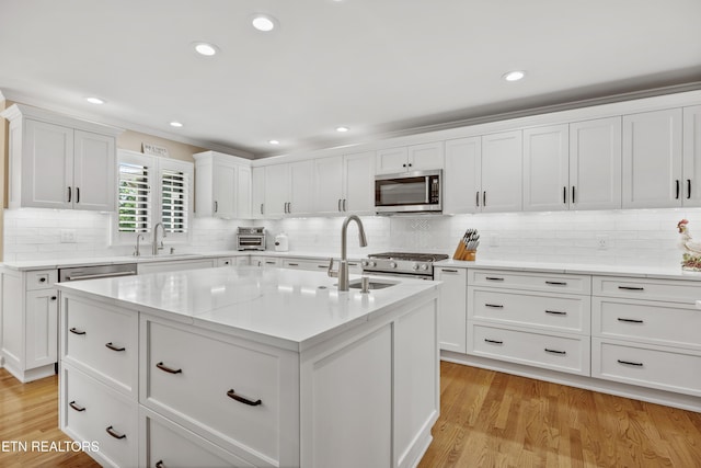 1647 Banebury Ln, Alcoa, TN 37701 - kitchen featuring stainless steel appliances, tasteful backsplash, white cabinetry, and recessed lighting