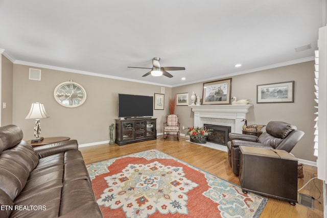 1647 Banebury Ln, Alcoa, TN 37701 - living area with a ceiling fan, a fireplace with flush hearth, ornamental molding, wood finished floors, and recessed lighting