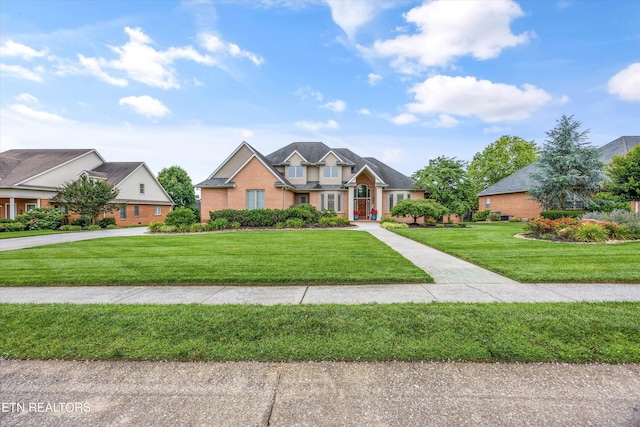 1647 Banebury Ln, Alcoa, TN 37701 - traditional home featuring a front lawn and brick siding