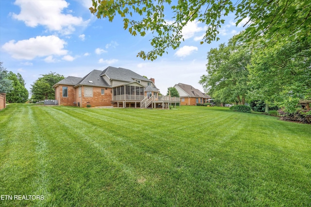 1647 Banebury Ln, Alcoa, TN 37701 - view of green lawn featuring a sunroom and a deck