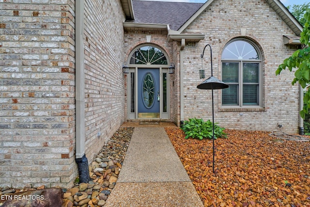 105 W Melbourne Rd, Oak Ridge, TN 37830 - doorway to property with brick siding and roof with shingles
