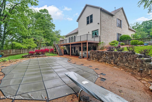 105 W Melbourne Rd, Oak Ridge, TN 37830 - rear view of property featuring stairs, a fenced backyard, a wooden deck, and brick siding