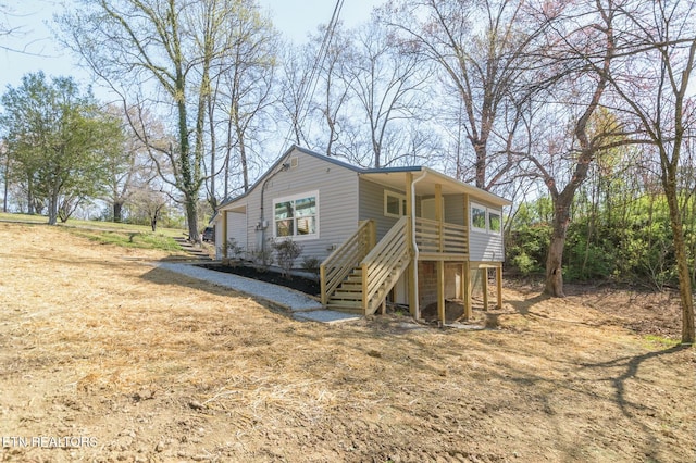 view of front of property featuring stairs