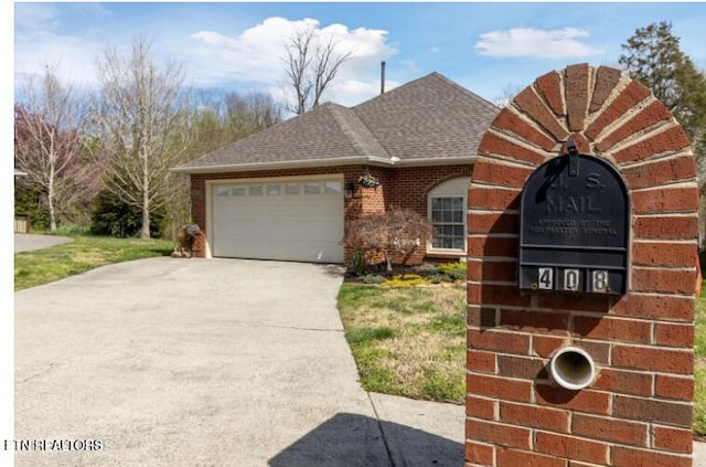 view of front facade featuring brick siding, a garage, driveway, and a shingled roof