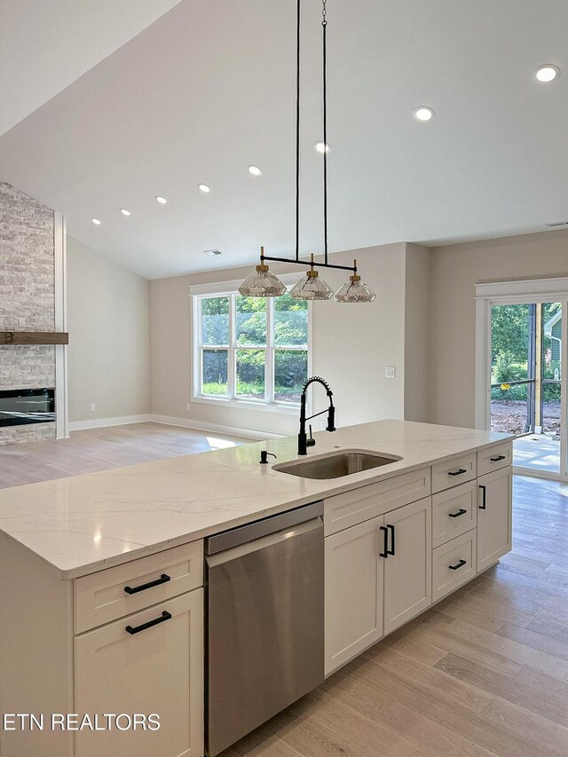 409 Goweli Trl, Vonore, TN 37885 - kitchen with stainless steel dishwasher, a sink, healthy amount of natural light, light wood finished floors, and recessed lighting