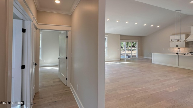 409 Goweli Trl, Vonore, TN 37885 - corridor with light wood-style flooring, baseboards, recessed lighting, a sink, and ornamental molding