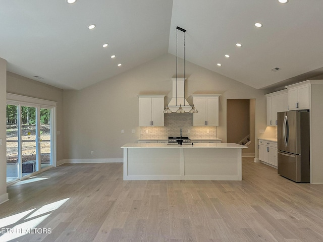 409 Goweli Trl, Vonore, TN 37885 - kitchen with freestanding refrigerator, premium range hood, a sink, light countertops, and recessed lighting