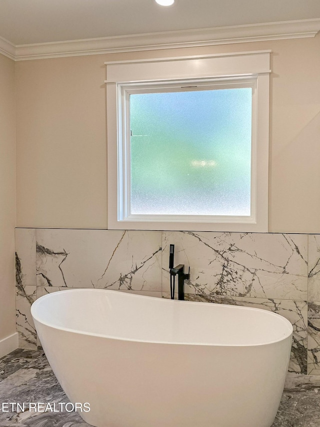 409 Goweli Trl, Vonore, TN 37885 - full bathroom with marble tiled flooring, crown molding, a freestanding tub, and tile walls
