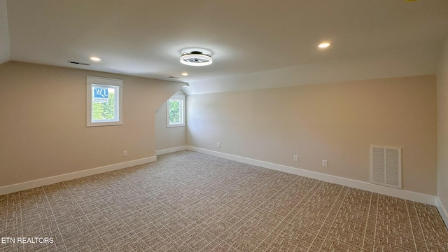 409 Goweli Trl, Vonore, TN 37885 - additional living space featuring lofted ceiling, recessed lighting, light colored carpet, and baseboards