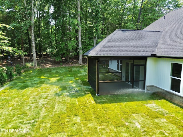 409 Goweli Trl, Vonore, TN 37885 - view of green lawn featuring a sunroom