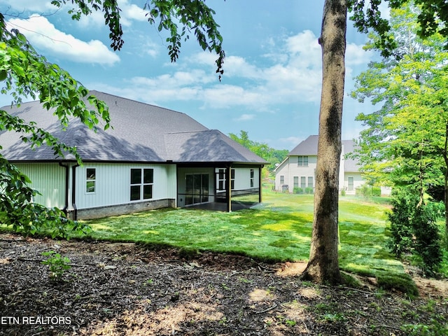 409 Goweli Trl, Vonore, TN 37885 - rear view of property with a shingled roof and a yard