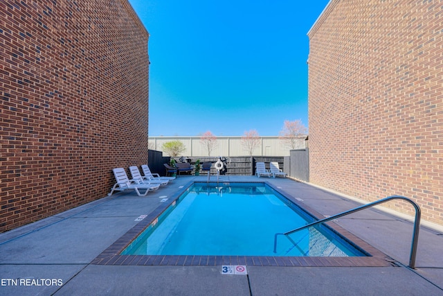 community pool with a patio