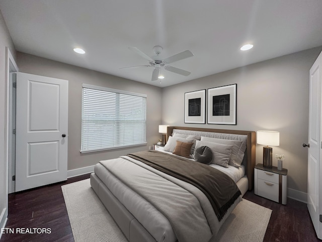 bedroom featuring recessed lighting, baseboards, and dark wood finished floors