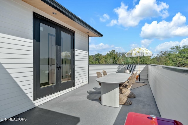 210 Granite Dr, Sevierville, TN 37876 - view of patio / terrace featuring a balcony, outdoor dining space, and french doors
