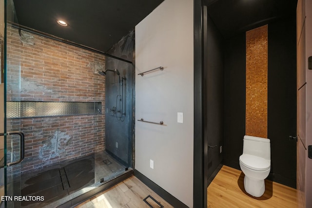 210 Granite Dr, Sevierville, TN 37876 - full bath featuring wood finished floors, visible vents, toilet, and a shower stall