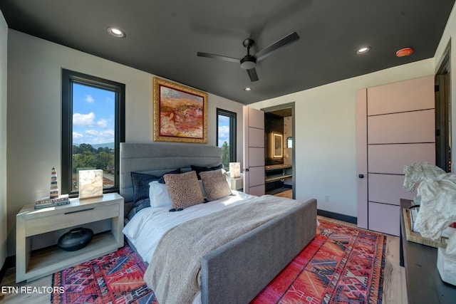 210 Granite Dr, Sevierville, TN 37876 - bedroom featuring recessed lighting, multiple windows, ceiling fan, and wood finished floors