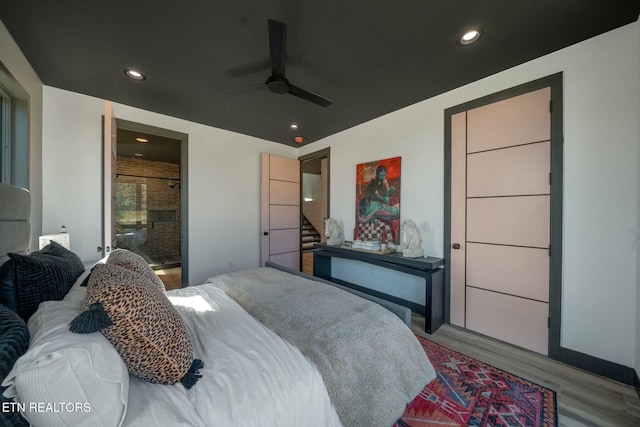 210 Granite Dr, Sevierville, TN 37876 - bedroom with ensuite bathroom, wood finished floors, ceiling fan, and recessed lighting