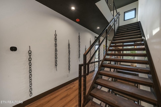 210 Granite Dr, Sevierville, TN 37876 - stairs with a high ceiling, wood finished floors, and recessed lighting