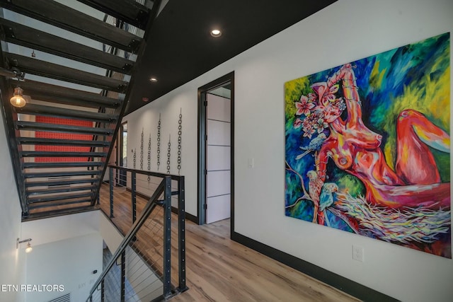 210 Granite Dr, Sevierville, TN 37876 - corridor featuring wood finished floors, an upstairs landing, and recessed lighting
