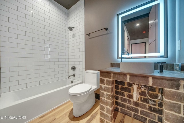 210 Granite Dr, Sevierville, TN 37876 - full bathroom with vanity, toilet, shower / bathtub combination, and wood finished floors