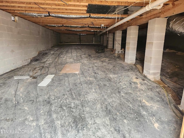 interior details featuring concrete block wall