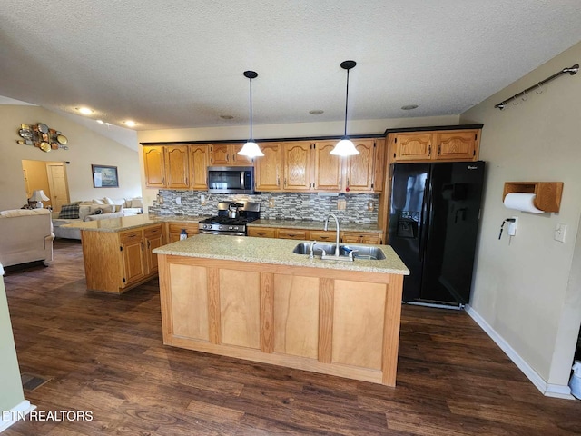kitchen featuring dark wood-style flooring, a sink, backsplash, and appliances with stainless steel finishes