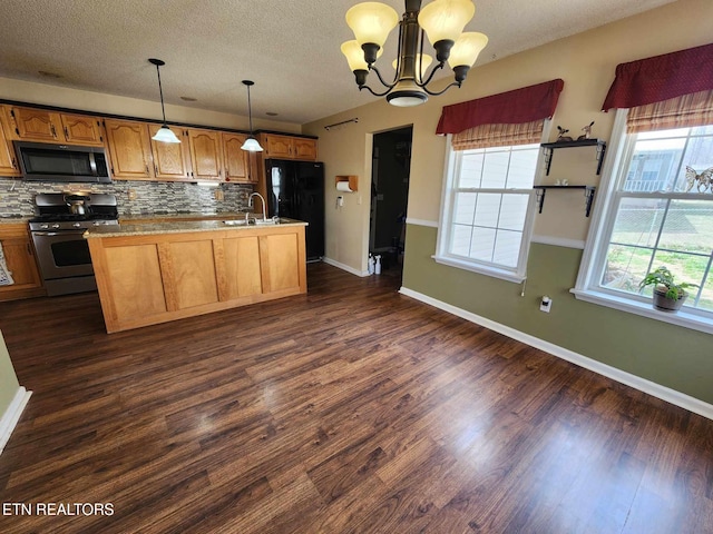 kitchen featuring decorative backsplash, a sink, stainless steel appliances, and dark wood finished floors