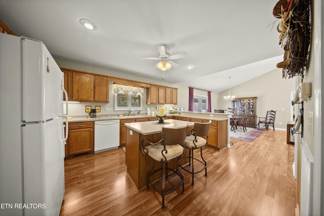 118 Windsor Rd, Crossville, TN 38558 - kitchen with light wood finished floors, light countertops, a peninsula, and white appliances