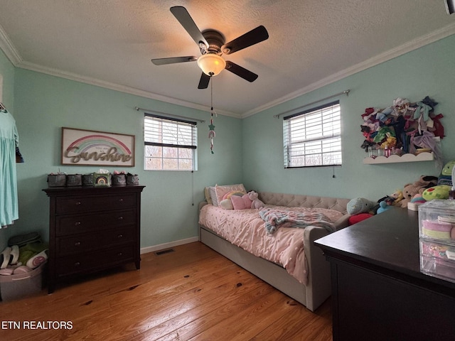1347 Leffle Webb Rd, Crossville, TN 38572 - bedroom featuring wood finished floors, a textured ceiling, visible vents, ceiling fan, and ornamental molding