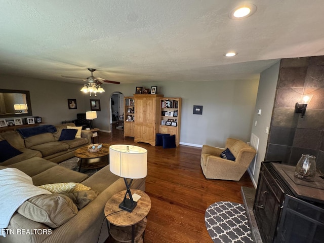 1347 Leffle Webb Rd, Crossville, TN 38572 - living area with dark wood-type flooring, a textured ceiling, arched walkways, ceiling fan, and recessed lighting