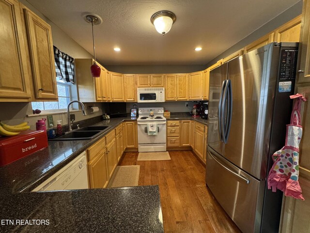 1347 Leffle Webb Rd, Crossville, TN 38572 - kitchen with dark wood finished floors, white appliances, dark countertops, and a sink
