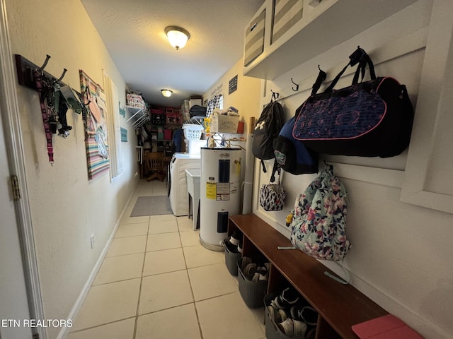 1347 Leffle Webb Rd, Crossville, TN 38572 - mudroom with washing machine and clothes dryer, a textured ceiling, visible vents, electric water heater, and tile patterned flooring