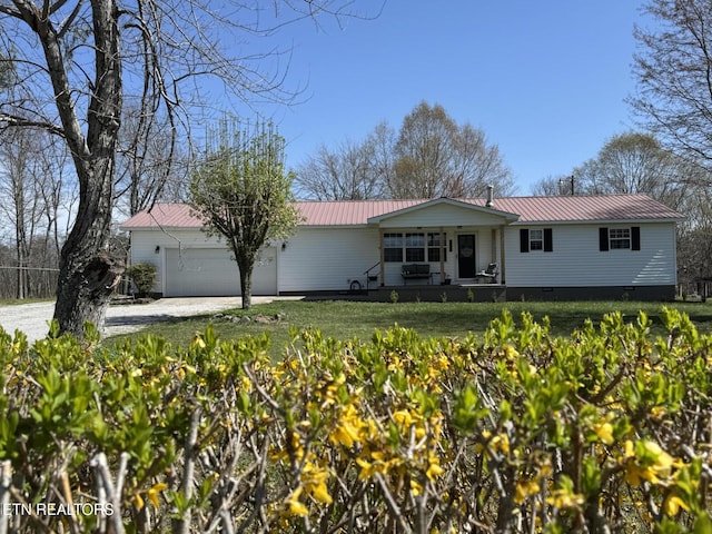 1347 Leffle Webb Rd, Crossville, TN 38572 - single story home with driveway, covered porch, metal roof, crawl space, and a garage