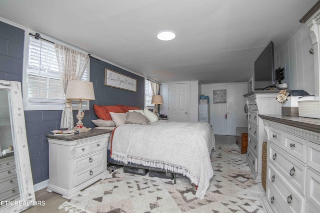 bedroom with light wood-type flooring