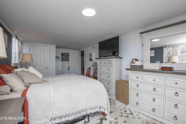 bedroom featuring crown molding