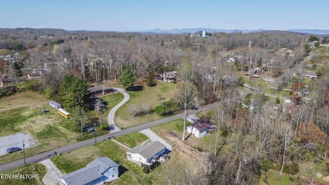 aerial view featuring a mountain view and a forest view