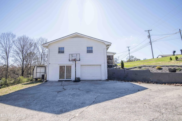 exterior space featuring driveway and an attached garage