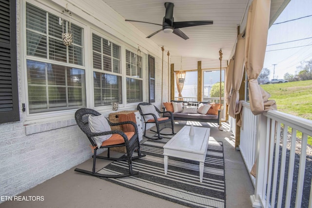 view of patio / terrace featuring a porch, outdoor lounge area, and ceiling fan