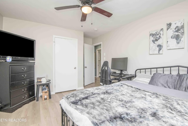 bedroom with wood finished floors and a ceiling fan