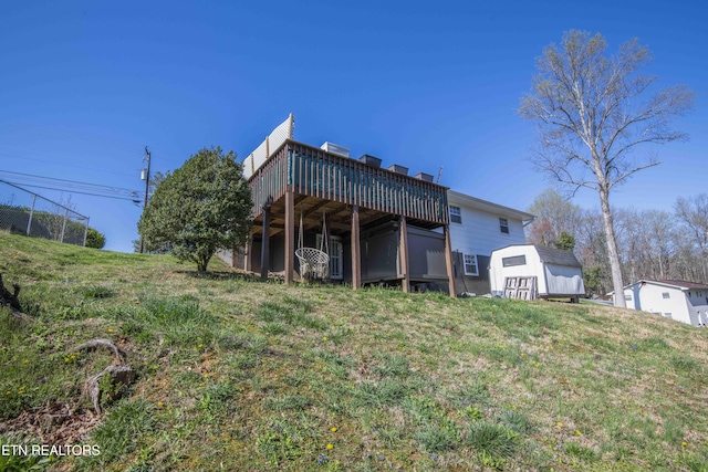rear view of property with a wooden deck