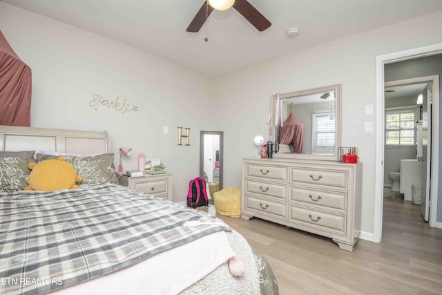 bedroom featuring light wood-type flooring and a ceiling fan
