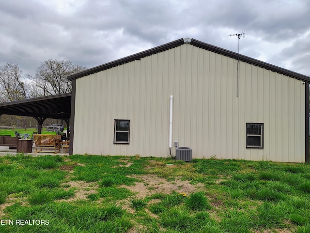 view of outdoor structure featuring central AC