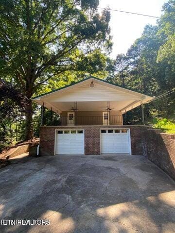 garage with concrete driveway