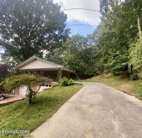 view of side of property featuring driveway
