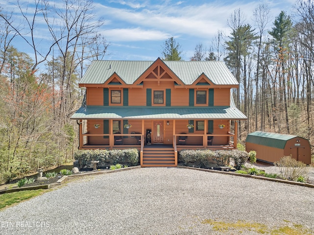 2164 Newt Huff Ln, Sevierville, TN 37862 - chalet / cabin featuring metal roof, an outdoor structure, a porch, and driveway