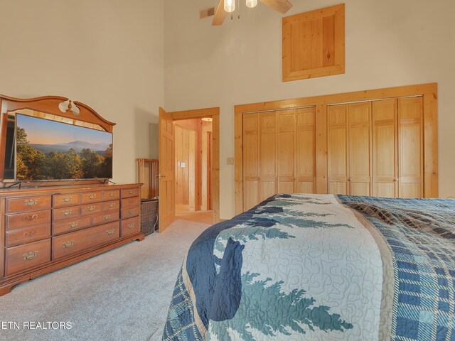 2164 Newt Huff Ln, Sevierville, TN 37862 - bedroom with visible vents, two closets, a ceiling fan, carpet floors, and a high ceiling